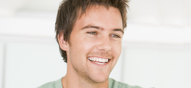 Three men smiling and laughing